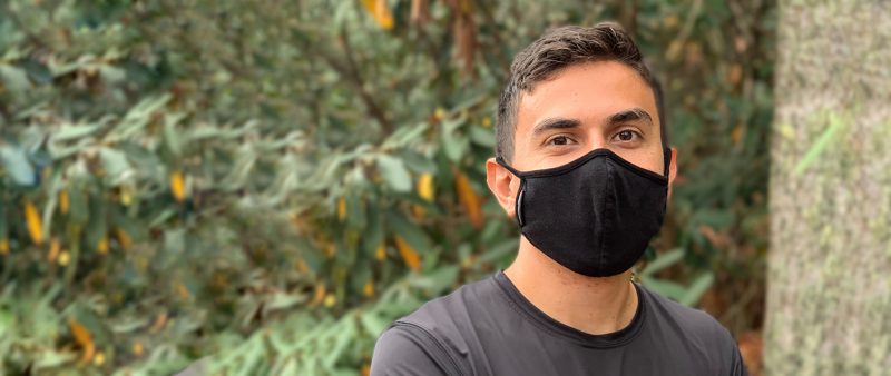 Didier Mena Aguilar standing outside with mask on