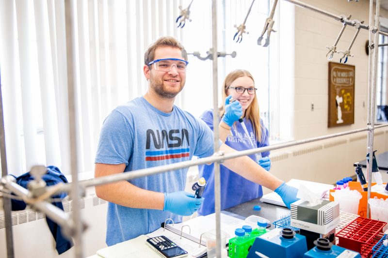 Two students working in a lab