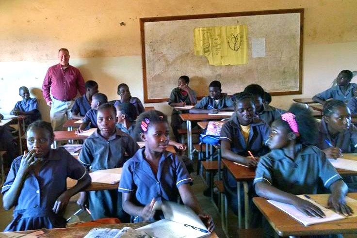 Michael Shumate in a classroom in Zambia