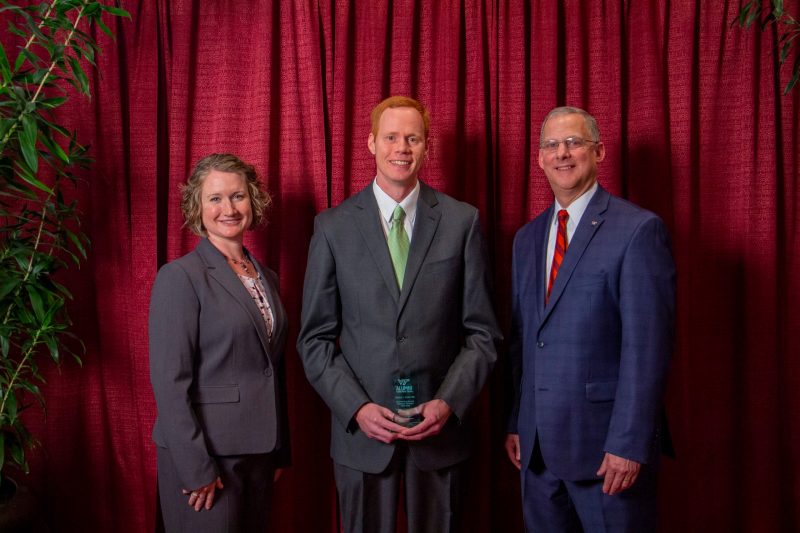 Shown: Rachel Kohl ’00, ‘02, president, CALS Alumni Organization; Daniel Frank ‘09,  Alan Grant, dean, CALS.