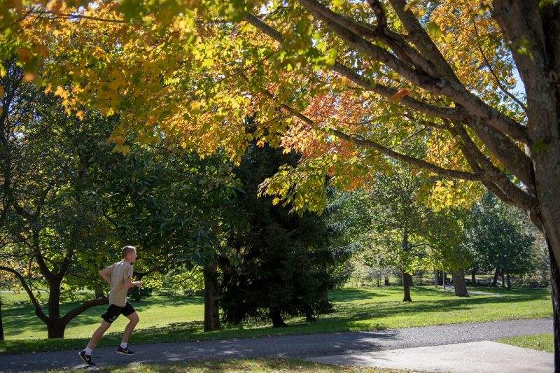 student running on campus