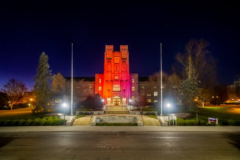 Burruss Hall lit at night