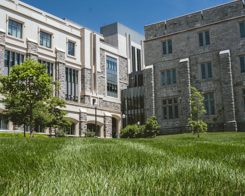 Grey Hokie Stone Holden Hall with freshly mowed grass in the foreground. 