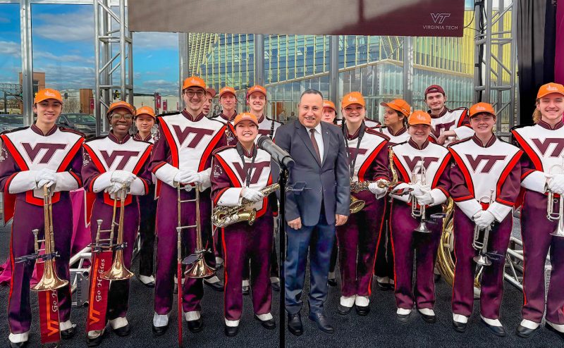 Alexandria University President Abdelaziz Konsowa poses for a photo with the Marching Virginians.
