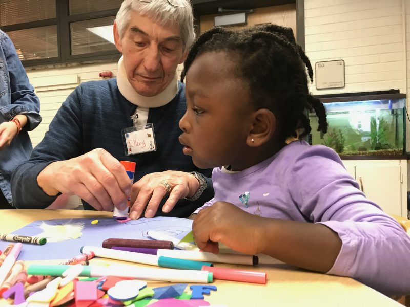 A young girl gets help from an adult at the CDCLR